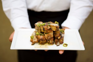 Grilled pork riblets with green onion, serrano chili and lime