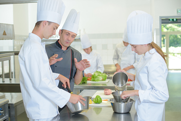Chef explaining to trainees