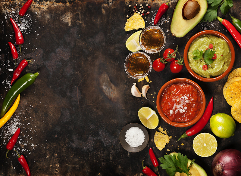 Green Homemade Guacamole with Tortilla Chips, Salsa and tequila